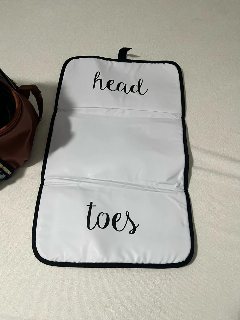 Itzy Ritzy Baby Diaper Bag Backpack in Black, White, brown with wipes case